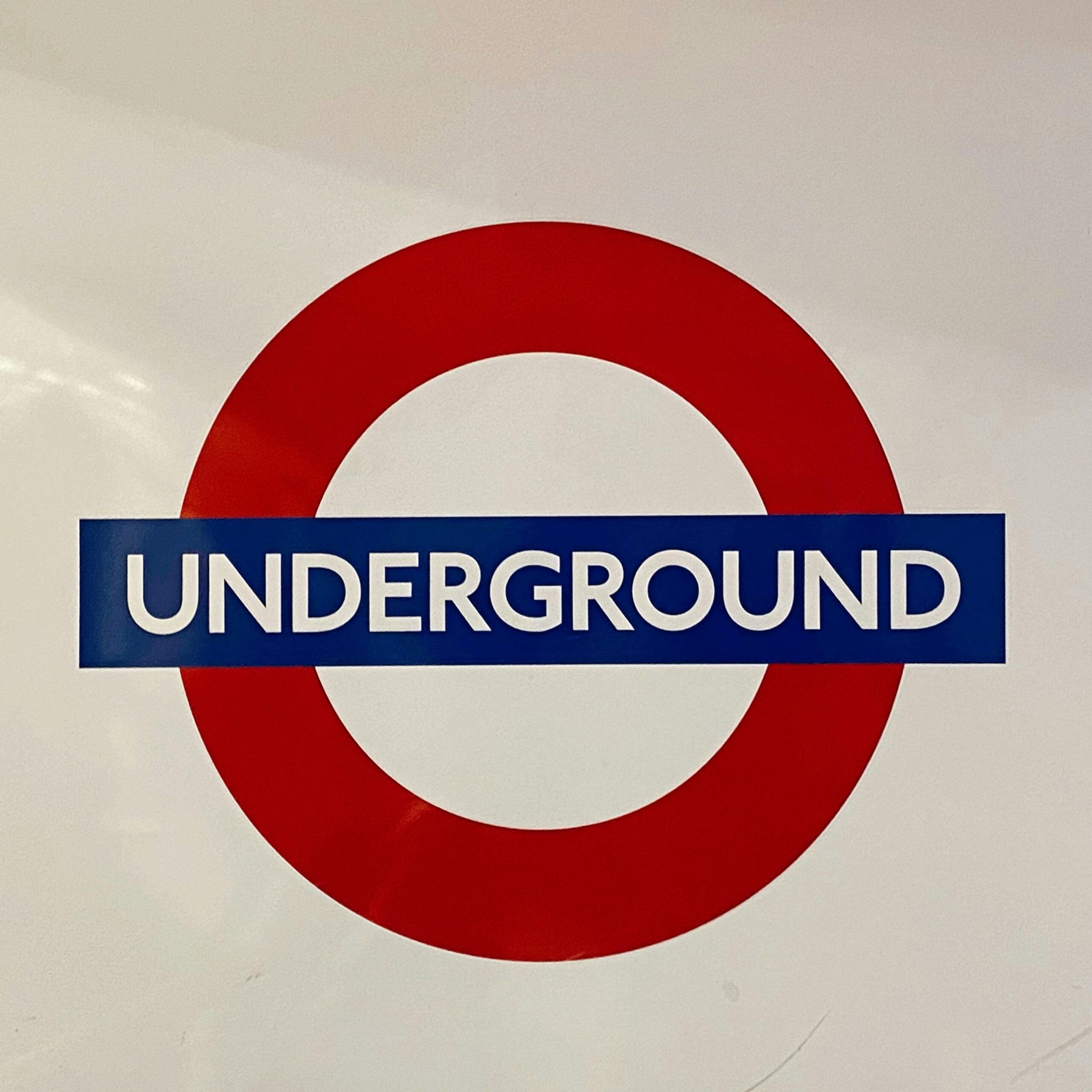 Iconic London Underground logo displayed on a white surface, representing public transport.
